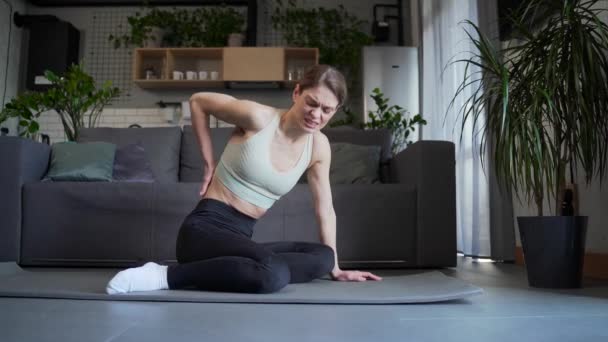 Young Sad Woman Feels Sudden Injuries Back Pain Ache Workout — Stock Video
