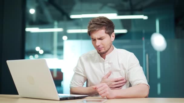 Young Employee Suffers Heart Attack Workplace Feeling Pain Holding His — Wideo stockowe