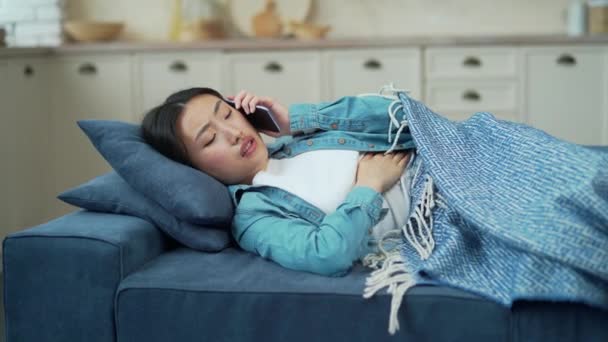 Sick Asian Woman Feeling Stomach Pain Lying Sofa Living Room — Vídeos de Stock