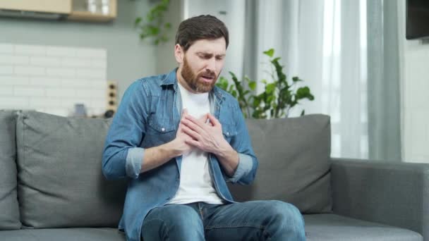 Man Having Heart Attack Sitting Alone Home Sofa Mature Bearded — Stockvideo