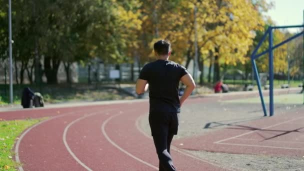 Rear View Adult Asian Jogger Running Track Urban City Stadium — Video