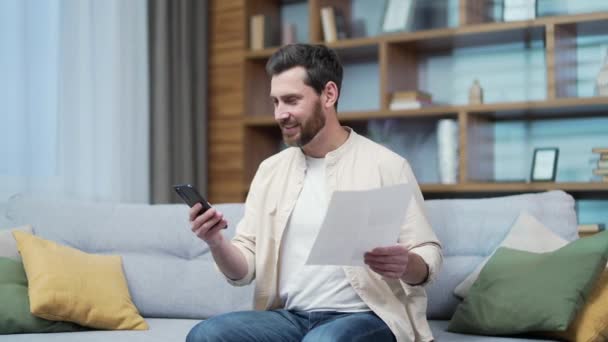 Mature Bearded Man Paper Work Paying Utility Bills Smartphone Gadget — Wideo stockowe