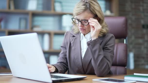 Tired Mature Businesswoman Experiencing Sharp Headache While Working Laptop Workplace — Stock Video