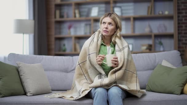 Sick Mature Blonde Woman Cold Wrapped Blanket Sitting Living Room — Stock videók