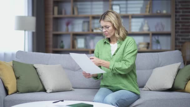 Confused Mature Woman Can Deal Documents Doing Home Accounting While — Wideo stockowe