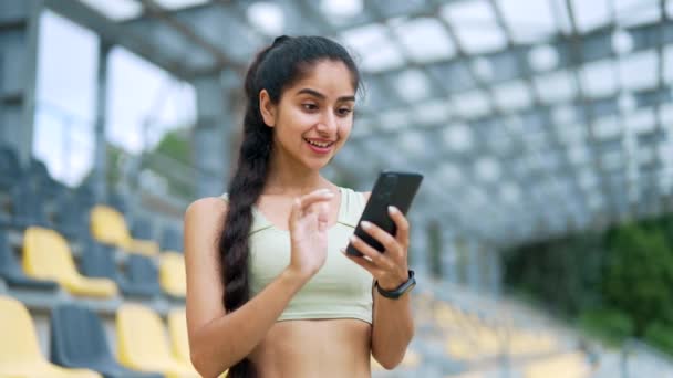 Happy Excited Young Sportswoman Checking Results Training While Looking Smartphone — Stock Video