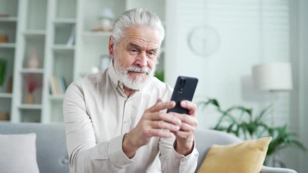 Happy Elderly Senior Man Gray Hair Received Great News Smartphone — Stock Video