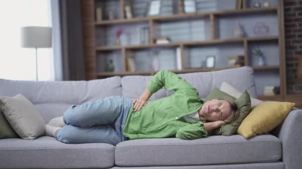 Sick Mature Woman Feeling Stomach Ache While Lying Sofa Living — Stock Video
