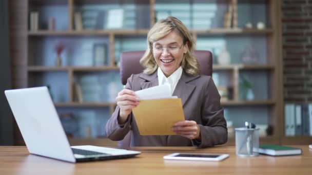 Happy Mature Businesswoman Reading Letter Good News Sitting Office Woman — Stock Video