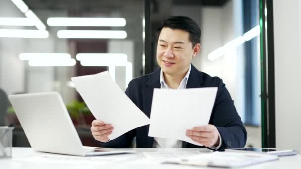 Happy Asian Businessman Satisfied Results Financial Report Reviewing Sitting Workplace — Stock Video