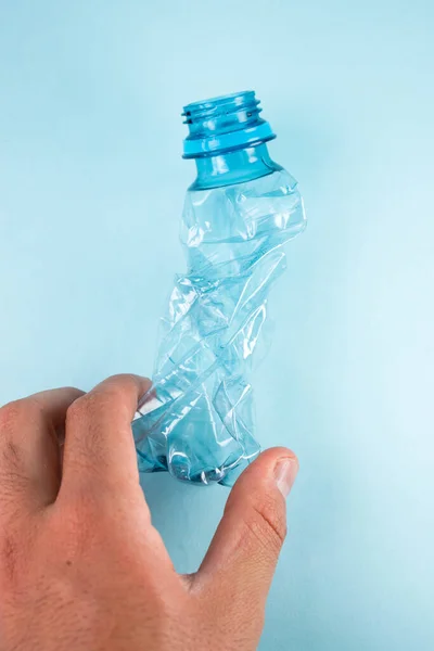 Hand Taking Plastic Stripped Bottle Blue Background — Stock Photo, Image
