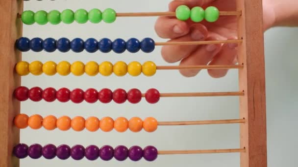 Hand Working Colorful Wooden Abacus Green Background — Video