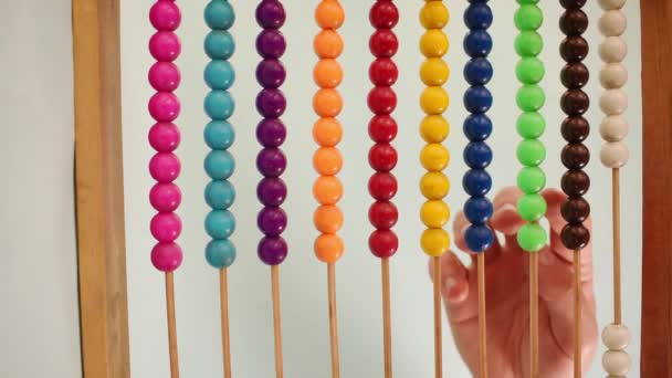 Vertical Video Hand Working Colorful Wooden Abacus Green Background — Vídeo de Stock