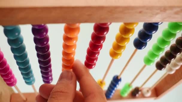 Vertical Video Hand Working Colorful Wooden Abacus Green Background — Vídeos de Stock