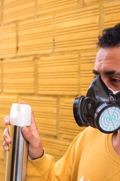 stock image Man taking off the gas mask on yellow background