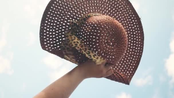 Vertical Video Hand Holding Wicker Hat Animal Print Ribbon — Stock Video