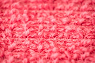 Arka plan olarak yünden yapılmış pembe dokuma dokusunu kapat