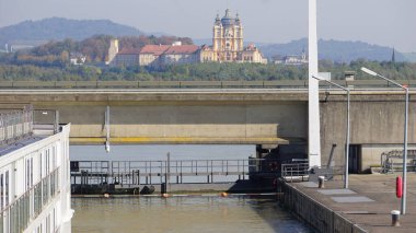 View on Melk Abbey from water chamber lock on Danube river, Austria