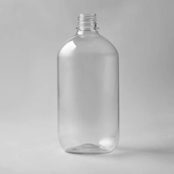 透明な光沢のあるプラスチックボトル フォトリアリスティックなパッケージモックアップテンプレートを隔離 ロイヤリティフリーのストック写真