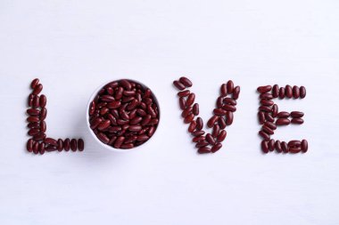 LOVE made from red kidney beans seed on white background, Valentine's day concept