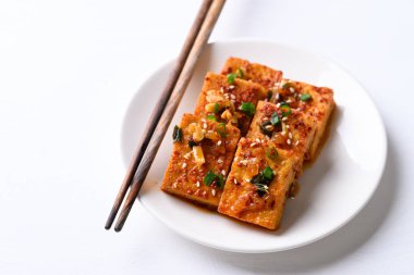 Korean side dish, spicy braised tofu (Dubu Jorim) on white background