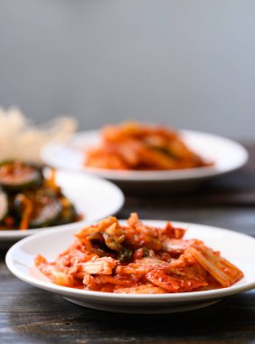 Kimchi cabbage, radish and cucumber on wooden background, Korean food homemade side dish