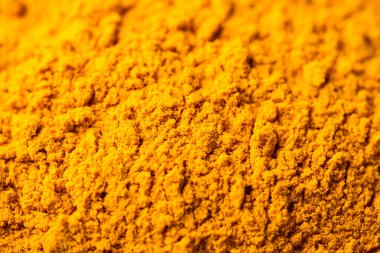 Zerdeçal tozu dokusu, Asya mutfağının içeriği, gıda boyası veya doğal boyama.