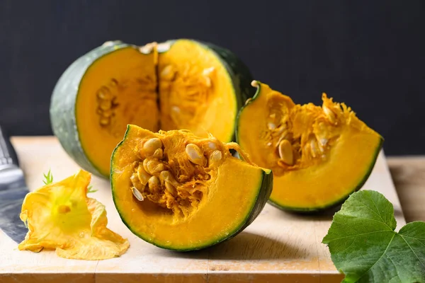 stock image Green Japanese pumpkin on wooden board prepare for cooking