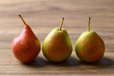 Fresh pear fruit on wooden background