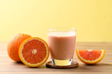 Orange yogurt smoothies in glass, Healthy fruit drink clipart