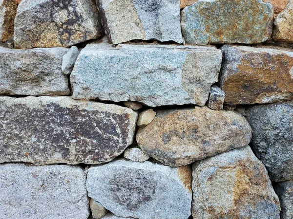 Traditional Korean style stone wall fence with sky background