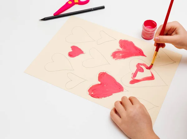 How to make cute paper heart for Valentines day. Children art project. Step by step photo instruction. Step 3. Paint the hearts.Close-up view