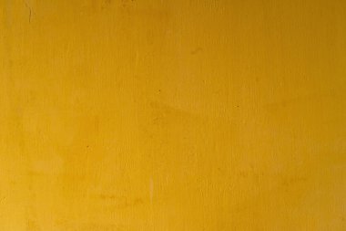 Soyut sarı çimento duvar dokusu ve arka plan. Modern duvar kâğıdı. Duvarın bazı grunge efektleri ve çizgileri vardır. Arkaplan ve doku kavramı.