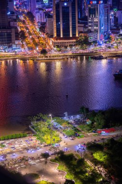 Ho Chi Minh city, Vietnam - 11 Sep 2022: Aerial view of Bitexco Tower, buildings, roads, Thu Thiem 2 bridge and Saigon river in Ho Chi Minh city - Far away is Landmark 81 skyscraper. Travel concept.