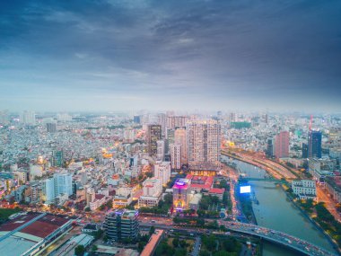 Ho Chi Minh city, Vietnam - 27 Aug 2022: Aerial panoramic cityscape view of Ho Chi Minh city and Saigon river, Vietnam. Center of heart business at downtown with buildings and towers.