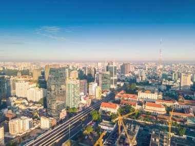 Ho Chi Minh city, Vietnam - 27 Aug 2022: Aerial panoramic cityscape view of Ho Chi Minh city and Saigon river, Vietnam. Center of heart business at downtown with buildings and towers.