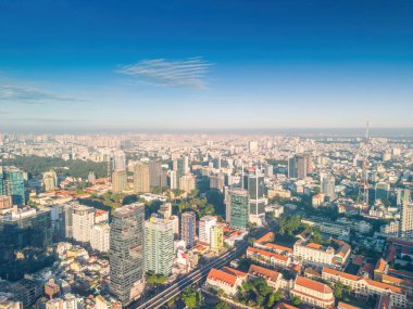 Ho Chi Minh city, Vietnam - 27 Aug 2022: Aerial panoramic cityscape view of Ho Chi Minh city and Saigon river, Vietnam. Center of heart business at downtown with buildings and towers.