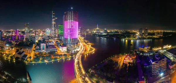 Ho Chi Minh city, Vietnam - 29 August 2022: Aerial view of Bitexco and IFC One Saigon Tower, buildings, roads, Thu Thiem 2 bridge and Saigon river - Far away is Landmark 81 skyscraper.