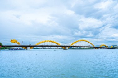 Da Nang City, Vietnam - 10 August, 2022 : Dragon River Bridge ( Rong Bridge) on a beautiful cloudy day. Travel concept