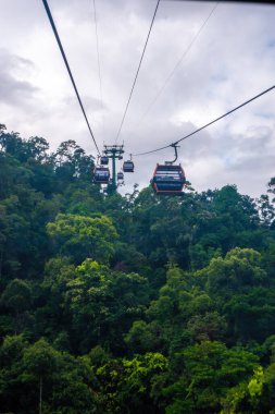 Cable cabs are running on high wire at Bana Hills in Danang, Vietnam. Bana Hills is interesting tourist new places to visit in Da Nang city, Vietnam. Travel concept.