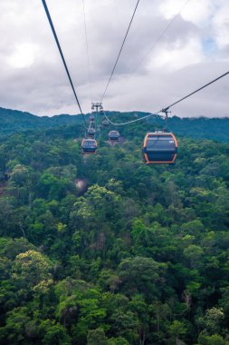Cable cabs are running on high wire at Bana Hills in Danang, Vietnam. Bana Hills is interesting tourist new places to visit in Da Nang city, Vietnam. Travel concept.
