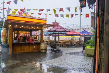 Da Nang city, Vietnam - 18 May 2022: Many tourists on European style streets in Ba Na Hills Mountain Resort with amusement rides, attractions, restaurants.The famous tourist destination in Da Nang