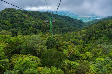 Cable cabs are running on high wire at Bana Hills in Danang, Vietnam. Bana Hills is interesting tourist new places to visit in Da Nang city, Vietnam. Travel concept.