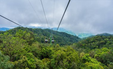 Cable cabs are running on high wire at Bana Hills in Danang, Vietnam. Bana Hills is interesting tourist new places to visit in Da Nang city, Vietnam. Travel concept.