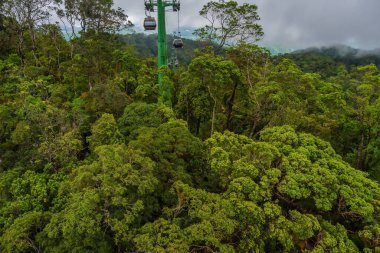 Cable cabs are running on high wire at Bana Hills in Danang, Vietnam. Bana Hills is interesting tourist new places to visit in Da Nang city, Vietnam. Travel concept.