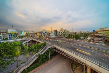 Ho Chi Minh city, Vietnam - 22 July 2022: View of Cha Va bridge, Ho Chi Minh City, Vietnam, at rush hour, many vehicles, motorcycle and car together on the road