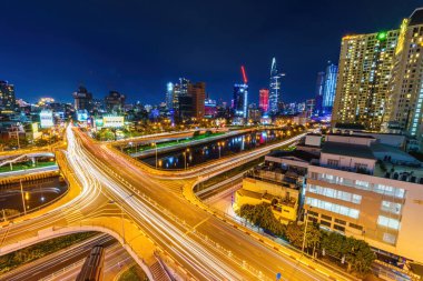 Ho Chi Minh city, Vietnam - 27 July 2022: View of Nguyen Van Cu bridge, Ho Chi Minh City, Vietnam, at rush hour, many vehicles, motorcycle and car together on the road