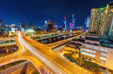 Ho Chi Minh city, Vietnam - 27 July 2022: View of Nguyen Van Cu bridge, Ho Chi Minh City, Vietnam, at rush hour, many vehicles, motorcycle and car together on the road