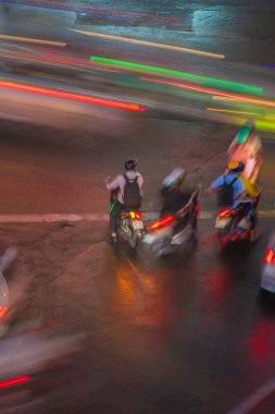 Ho Chi Minh City, Vietnam - 01 August, 2022 : Phu Dong Six-Way Intersection in motion. This is a famous intersection in Central of Ho Chi Minh City. Colorful night. Travel concept