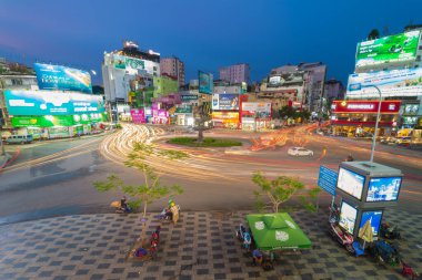 Ho Chi Minh City, Vietnam - 01 August, 2022 : Phu Dong Six-Way Intersection in motion. This is a famous intersection in Central of Ho Chi Minh City. Colorful night. Travel concept